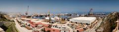 Panoramic view of Bibiheybat with sea, coastal structures and green areas under blue sky
