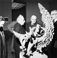 50 Years of US Art Exhibition Opening featuring a well-dressed crowd and art gallery interiors