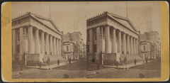 Historic photograph of U.S. Treasury building and Wall Street with early 20th century urban architecture and pedestrian activity
