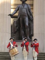 2015 Evacuation Day Commemoration ceremony at Federal Hall with reenactors and historic map displays