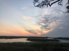 Sunrise over marsh and Horseshoe Creek at Cedar Point with vibrant sky colors