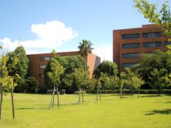 Backyard of Osaka Gakuin University with greenery and buildings in Osaka, Japan