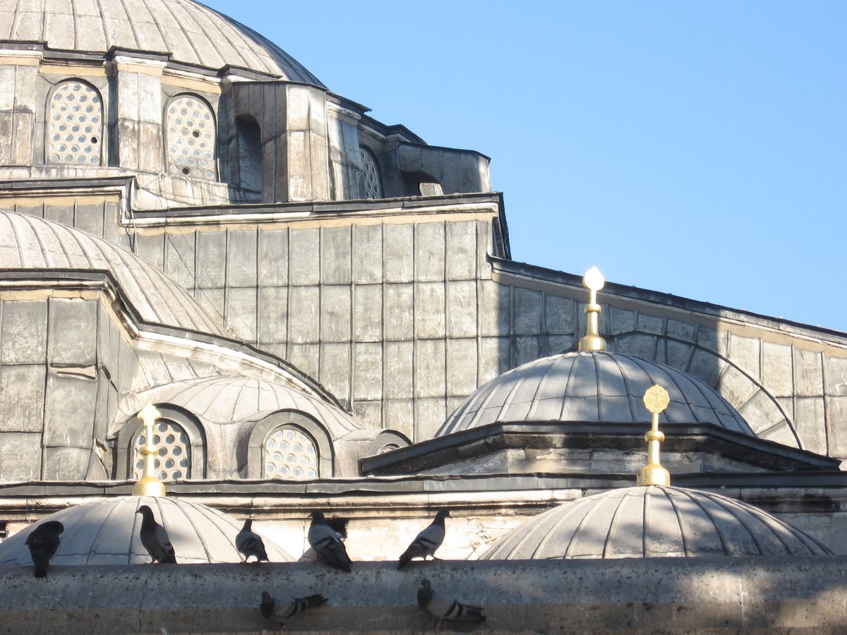 Detail of the exterior of the mosque in Kılıç Ali Paşa Complex with intricate stone carvings and traditional Ottoman architectural elements, Tophane, Istanbul