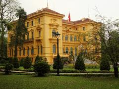 Presidential Palace of Vietnam in Hanoi with distinctive yellow facade and wrought iron gates