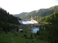 Medeo ice skating rink in Almaty with mountains in the background