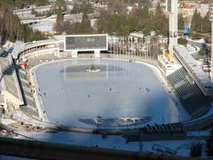 View of Medeo outdoor ice skating rink in Almaty surrounded by mountains
