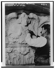 Cathedral of St. John the Divine with workers sculpting an angel figure