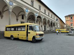 Yellow school buses parked in a row in Florence