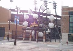 Ferris wheel at Comerica Park during twilight with stadium lights on