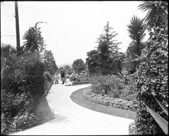 Five young children in Sunday clothes posing in a landscaped yard on Hollywood Boulevard circa 1905