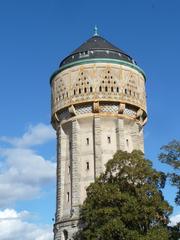 Historic water tower in Metz, France under clear blue sky