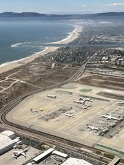 Aerial view of Los Angeles International Airport with airplanes and terminals, July 2022