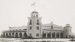 Exterior view of Hangar 1 at Los Angeles Airport with aircraft and open hangar doors