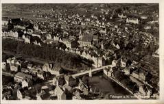 Aerial view of Tübingen Altstadt, Neckarbrücke and Neckarvorstadt with historic buildings and Neckar River