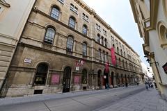 Street view of Herrengasse in Vienna with historic buildings and tram tracks