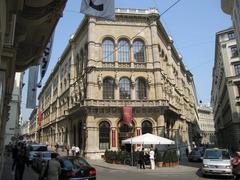 Palais Ferstel building in Herrengasse, Vienna with one facade and two number plates blurred