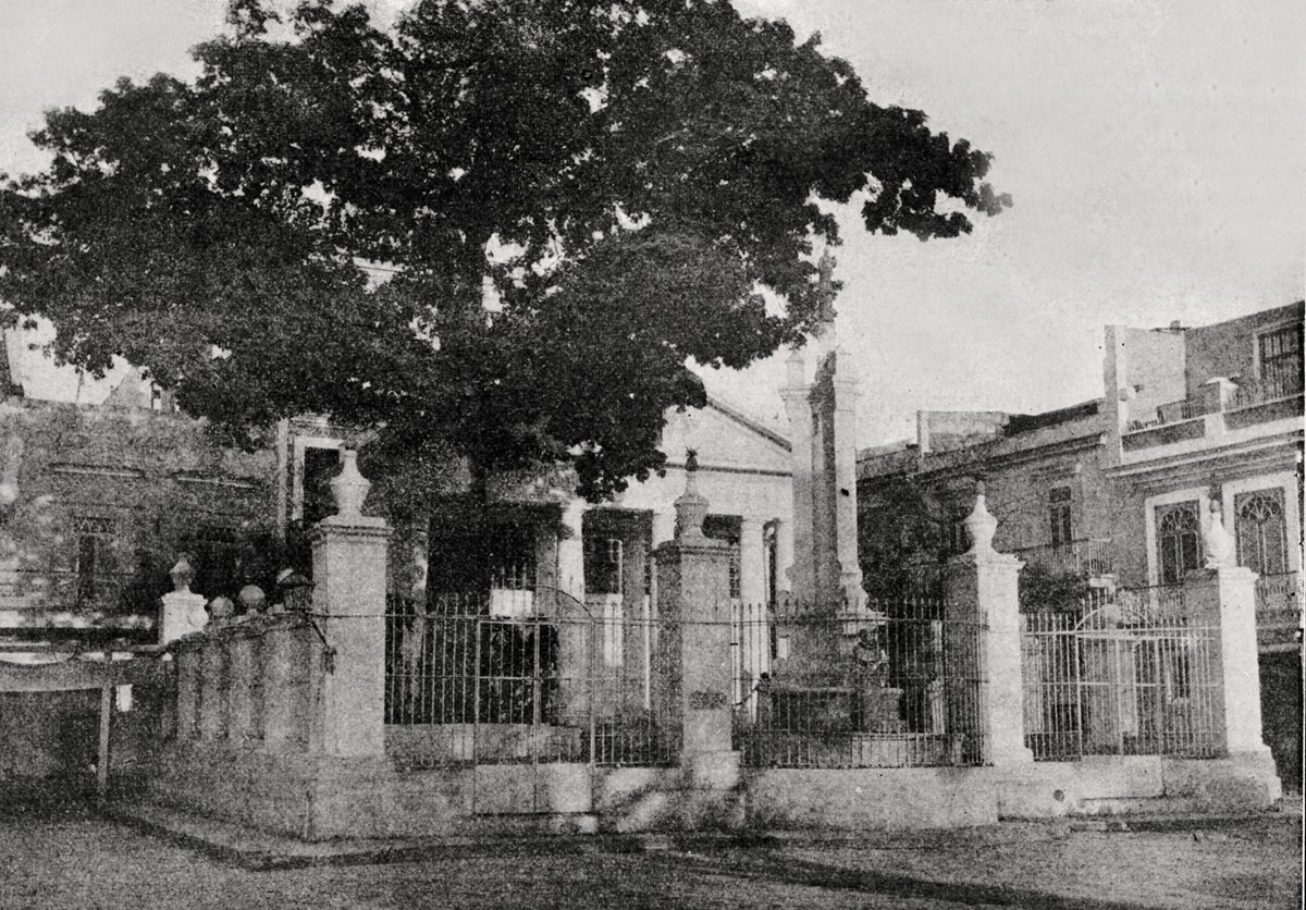 Memorial site of the first mass and first Cabildo meeting in Cuba with neoclassical building and ceiba tree in Havana