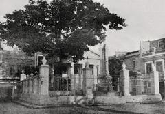 Memorial site of the first mass and first Cabildo meeting in Cuba with neoclassical building and ceiba tree in Havana