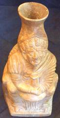 Decorative sculpted pottery vessel