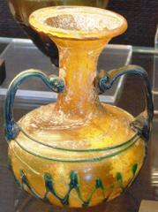 Small glass bottle with a round body and narrow neck