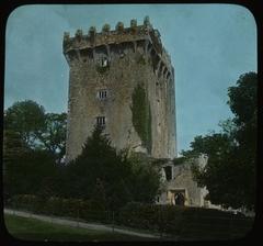 View of Blarney Castle in Ireland surrounded by lush greenery