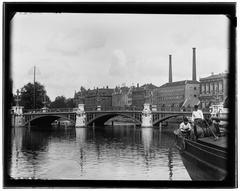 Street view of Amstel 1 to 25 in Amsterdam looking north towards Blauwbrug bridge in 1890