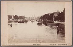 View of the Amstel River in northern direction from Hogesluis towards Amstelsluizen and Blauwbrug bridge in 1883