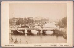 View of the Amstel River in southern direction with the Blauwbrug bridge in the foreground and Magere Brug bridge behind, Amsterdam circa 1887