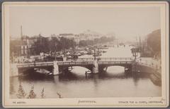 View of the Amstel River in southern direction with Blauwbrug in the foreground and Magere Brug behind