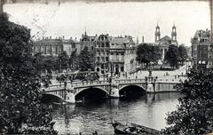 Vintage postcard of Amsterdam featuring the Blauwbrug bridge with Bensdorp cacao advertisement in 1909