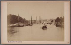 Amstel River view north towards Blauwbrug with stone bridge under construction and wooden temporary bridge in 1883
