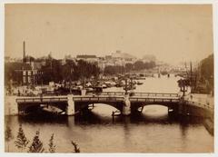 Blauwbrug bridge over Amstel river with Magere Brug bridge in background Amsterdam