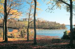 Autumn view of the tombolo connecting two drumlins at World's End with golden trees and salt-tolerant grasses