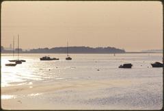 View of Boston Harbor Islands from Morrissey Boulevard toward Thompsons Island under cloudy sky