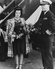 Rear Admiral Wilson Brown and Miss Lillian E. Earley at the launching ceremony of LST 305 on 10 October 1942 at Boston Navy Yard