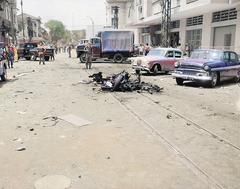 Colorized scene of Viet Cong terrorist bombing damage in Saigon during 1965 Vietnam War