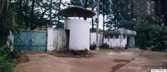 US Embassy Saigon vehicle gate in 1995 with security barriers and signage