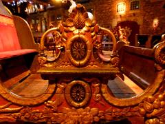 Detailed close-up of Carosse de manège carousel carriage at Musée des Arts forains
