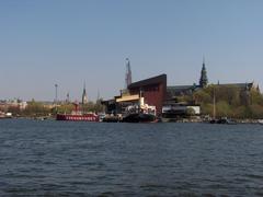 View of Djurgården island featuring Vasamuseet and Nordiska museet from Djurgårdsfärjan ferry in spring
