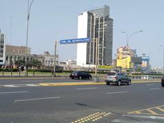 Entrance to the Metropolitano tunnel with train tracks and urban surroundings