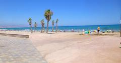 Sunny beach at Playa de San Juan in Alicante with golden sand and blue sea