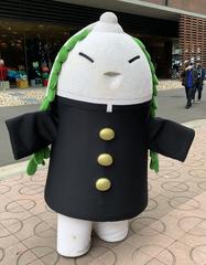 Harves Festival mascot Daikonnkun holding a large radish