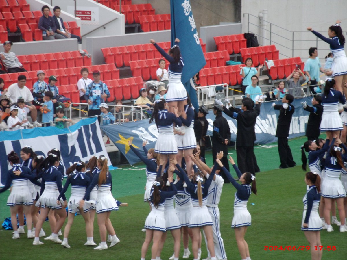 Kinki University cheerleading team performing at Hanazono Rugby Stadium in June 2024