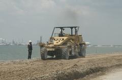 Construction crews repairing a road on Texas City dike after Hurricane Ike