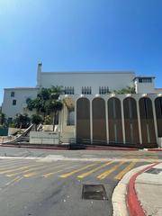 Building on the campus of San Diego State University with modern architectural design and blue sky