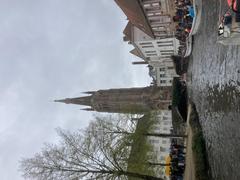Scenic Brugge canal with historic buildings and boats during sunset