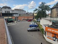 Brno city street near OC Dornych shopping center with modern buildings and tram tracks