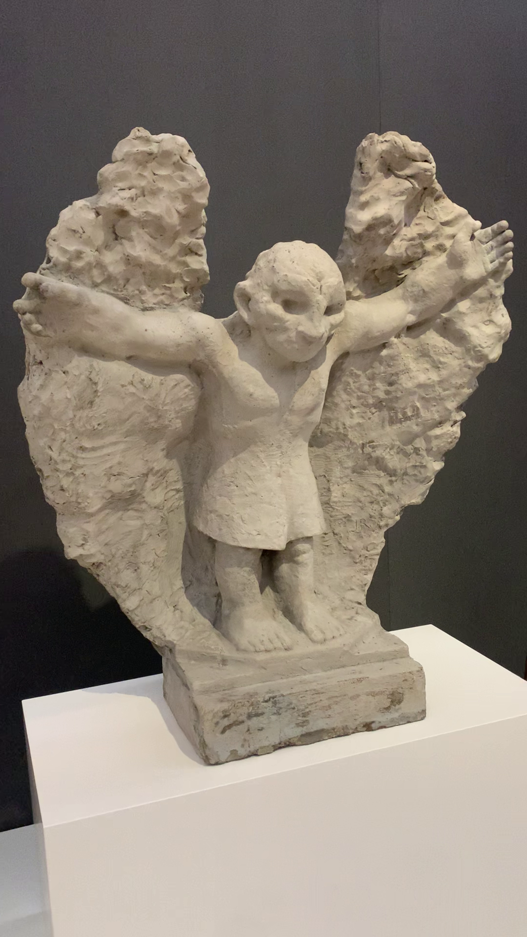 Concrete statue of 'Mannetje met vleugels' winged male figure by John Rädecker