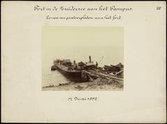 Construction of gun turrets on Pampus Fort in the Zuiderzee, part of the Amsterdam Defense Line, unloading armor plates to the fort