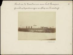 Historical photograph of gun turret constructions at Fort Pampus in the Zuiderzee showing armored sections after assembly